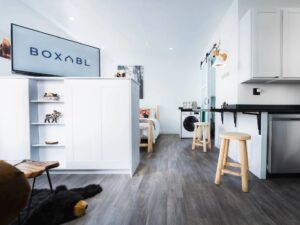 Interior view of a Boxabl modular home installed by Skybleu in the Bay Area, showing kitchen, laundry, and living space.
