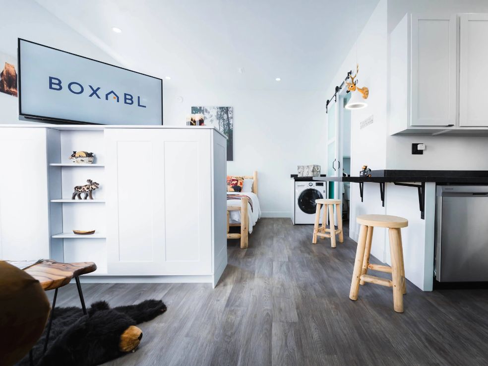 Interior view of a Boxabl modular home installed by Skybleu in the Bay Area, showing kitchen, laundry, and living space.